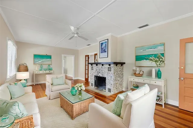 a living room with furniture and a fireplace