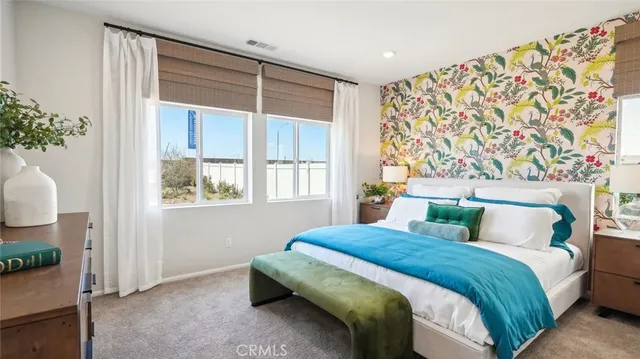 a bathroom with a sink a mirror a vanity and shower