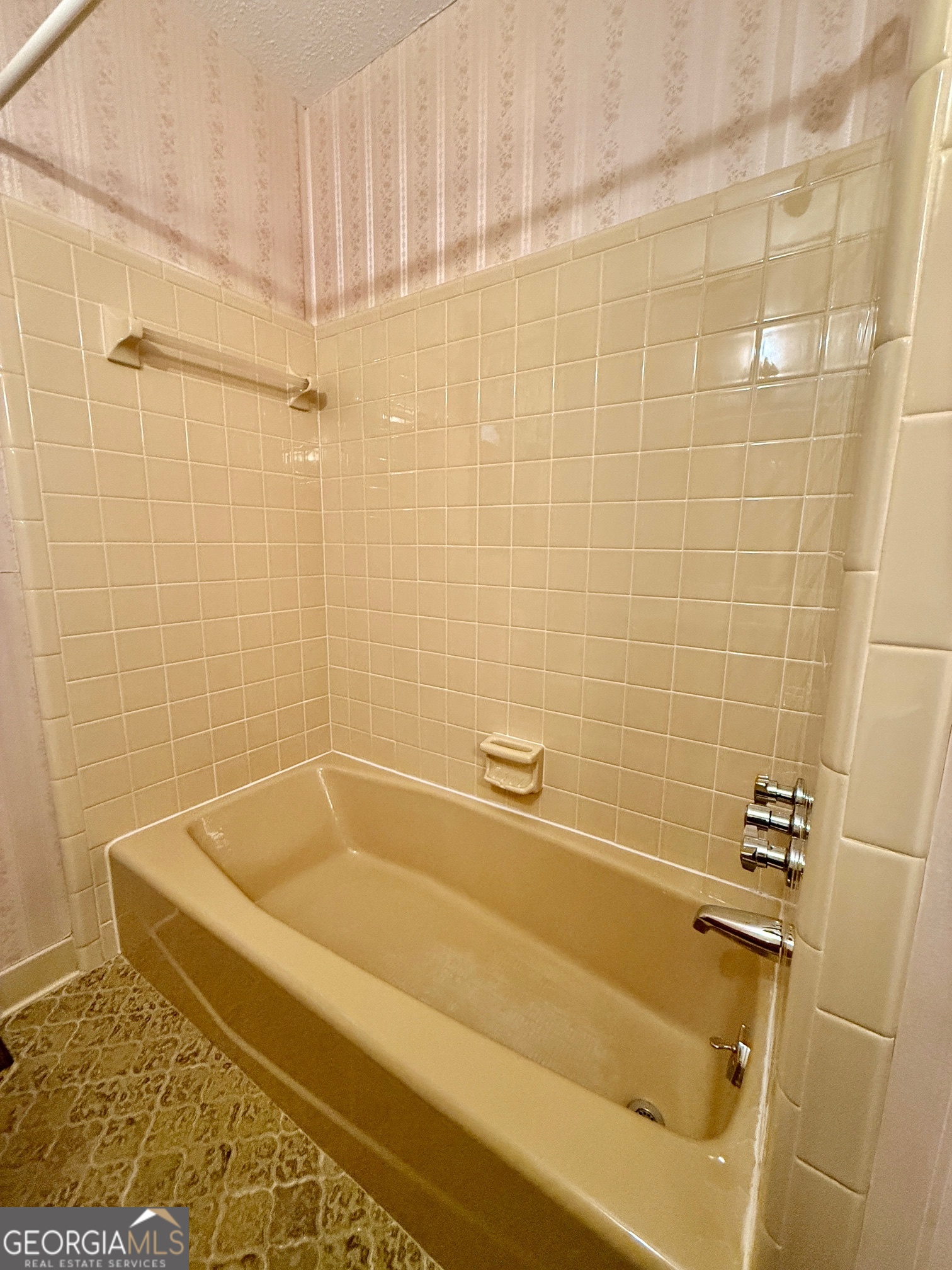 5741 Lawrence Court Macon, GA 31216 - Photo 14 of 22 a bath tub sitting next to a white sink and a shower