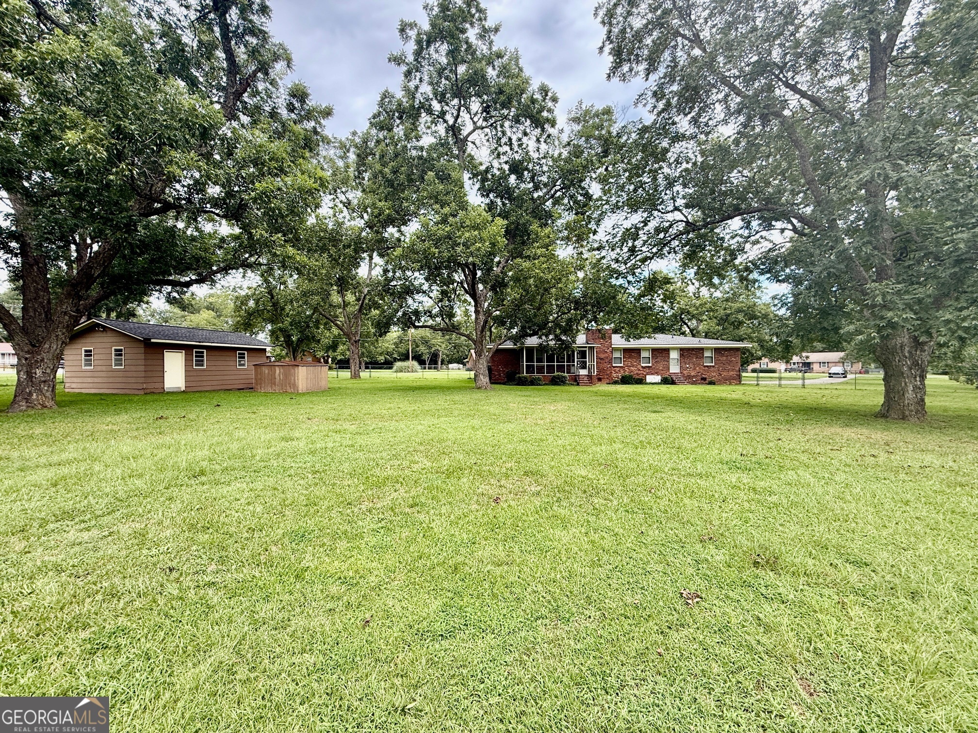 5741 Lawrence Court Macon, GA 31216 - Photo 20 of 22 a view of a house with a yard and sitting area