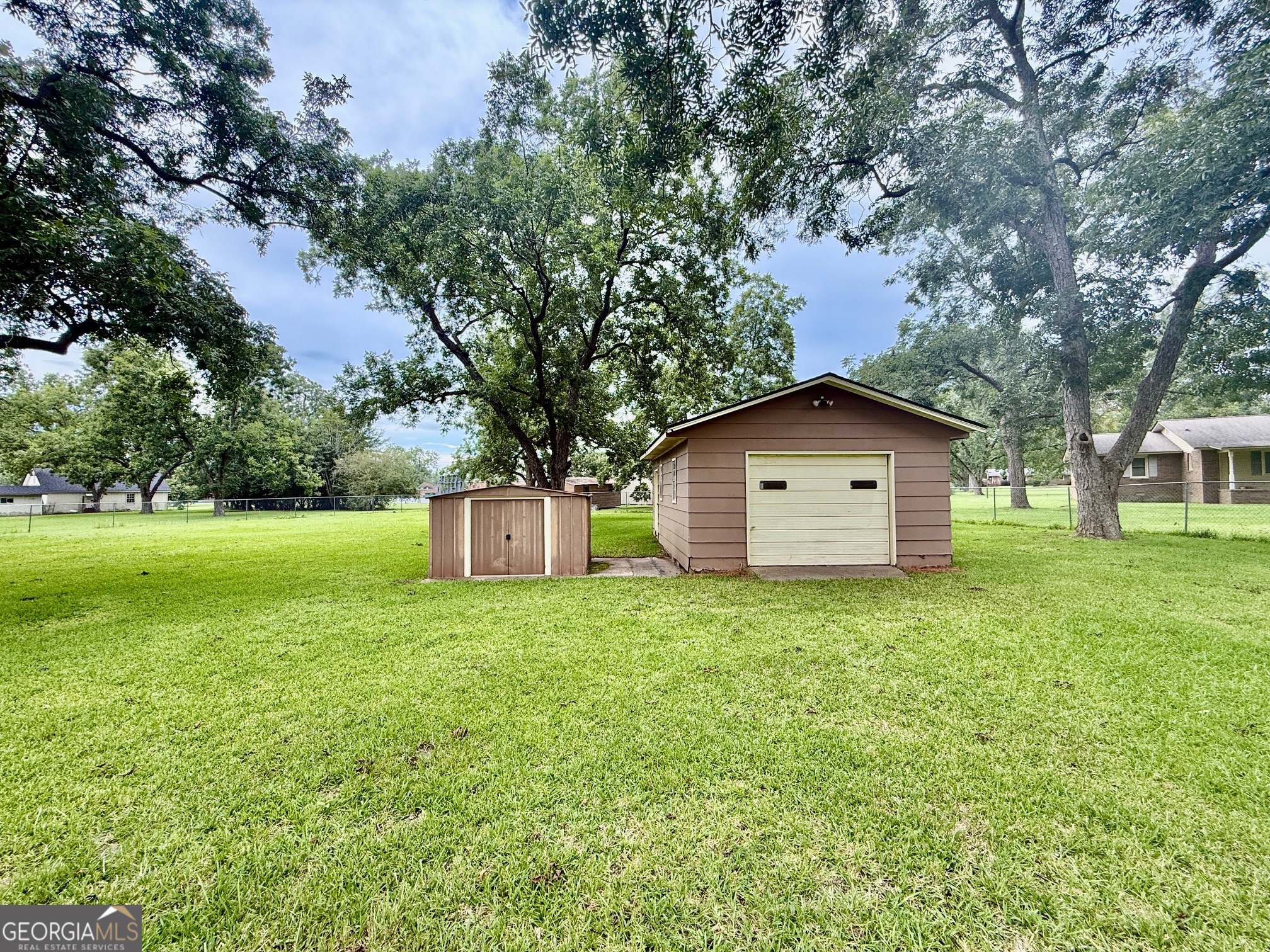 5741 Lawrence Court Macon, GA 31216 - Photo 21 of 22 a house with a tree in front of it