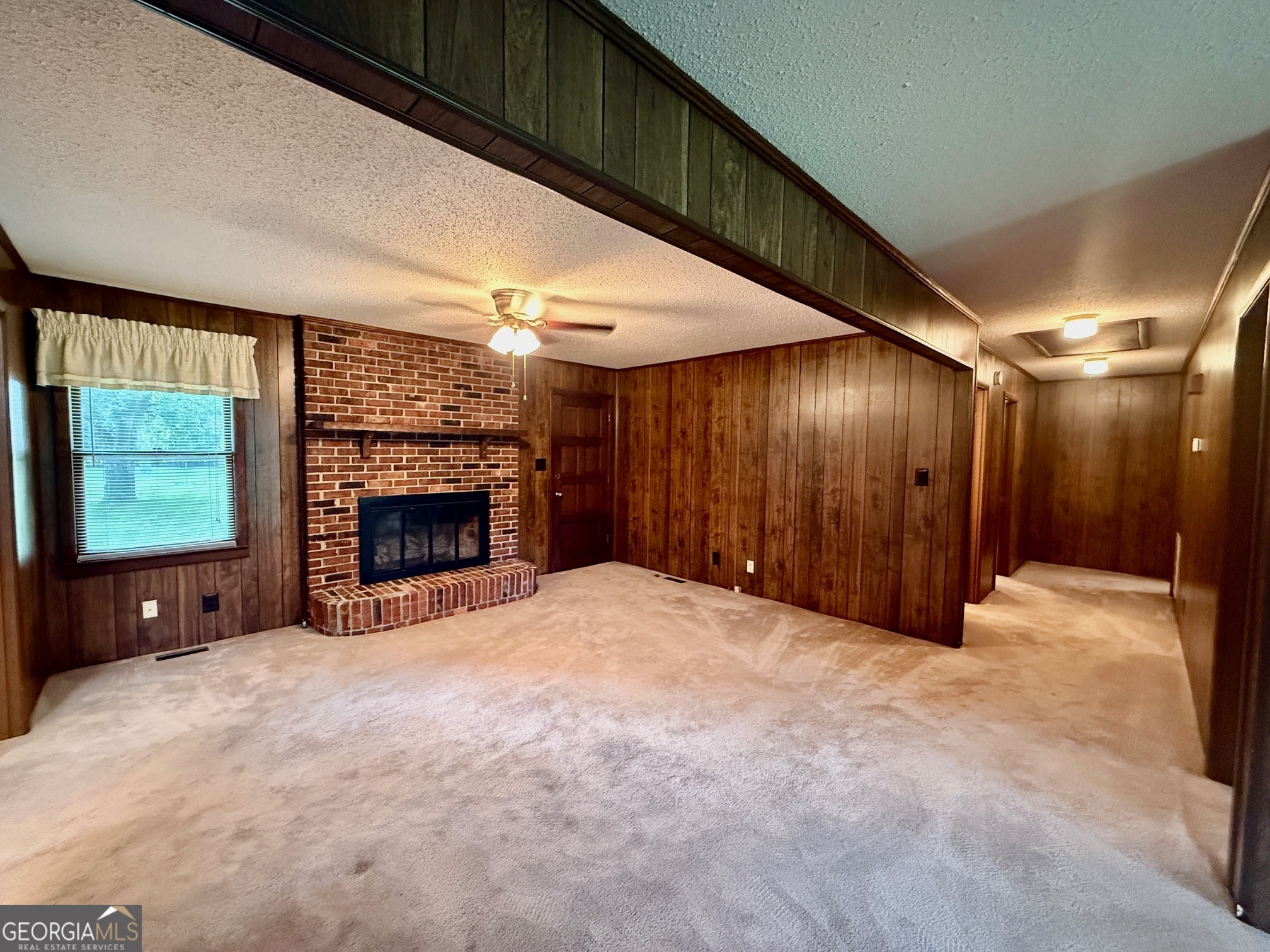 5741 Lawrence Court Macon, GA 31216 - Photo 3 of 22 a view of empty room with a fireplace