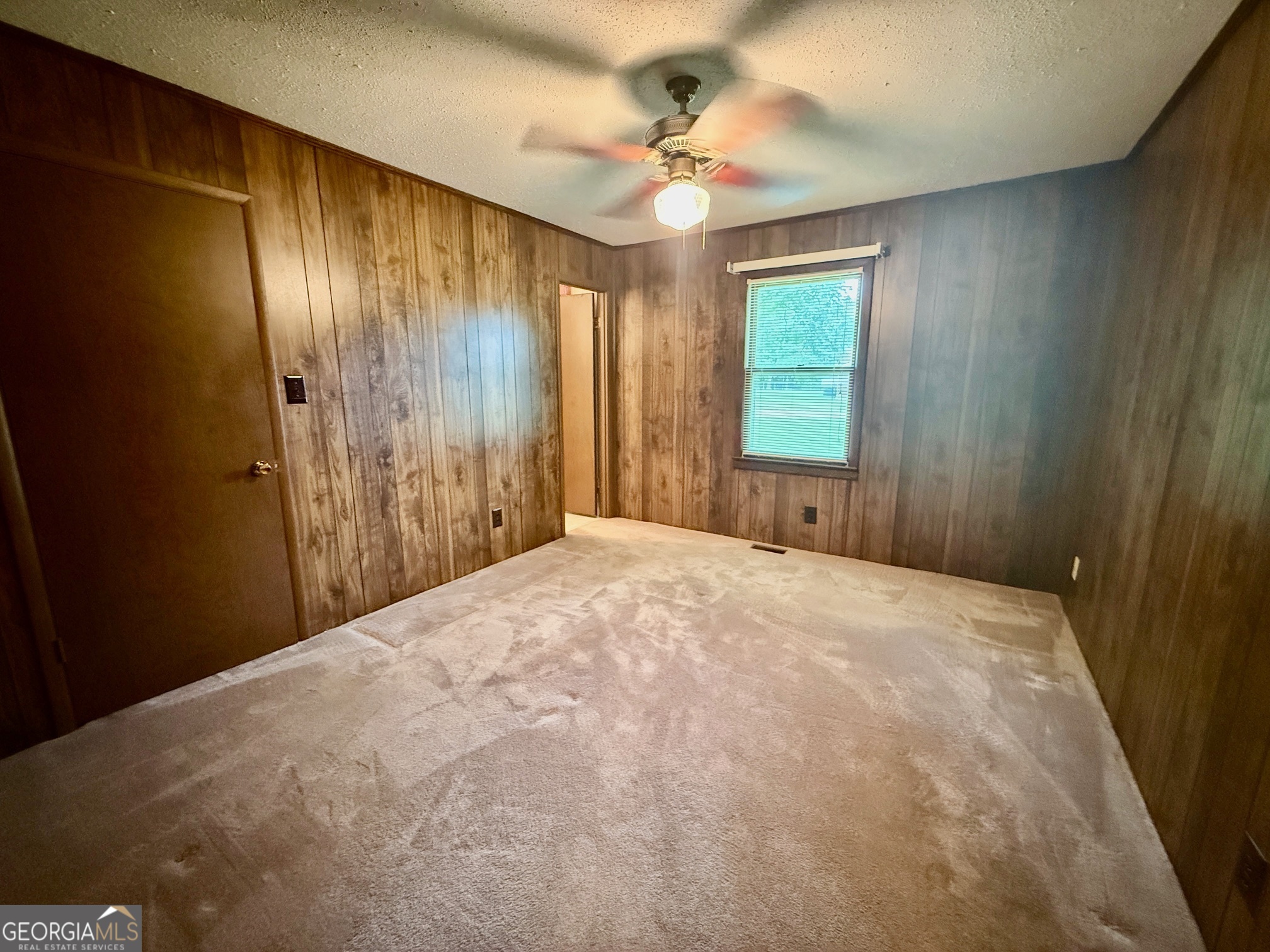 5741 Lawrence Court Macon, GA 31216 - Photo 8 of 22 a view of a livingroom with a chandelier fan