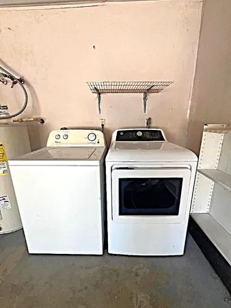a utility room with dryer and washer
