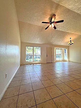 a view of an empty room and window