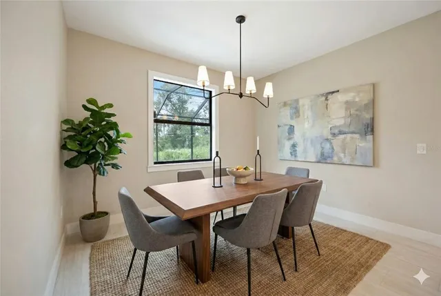 a view of a kitchen with a refrigerator and a chandelier