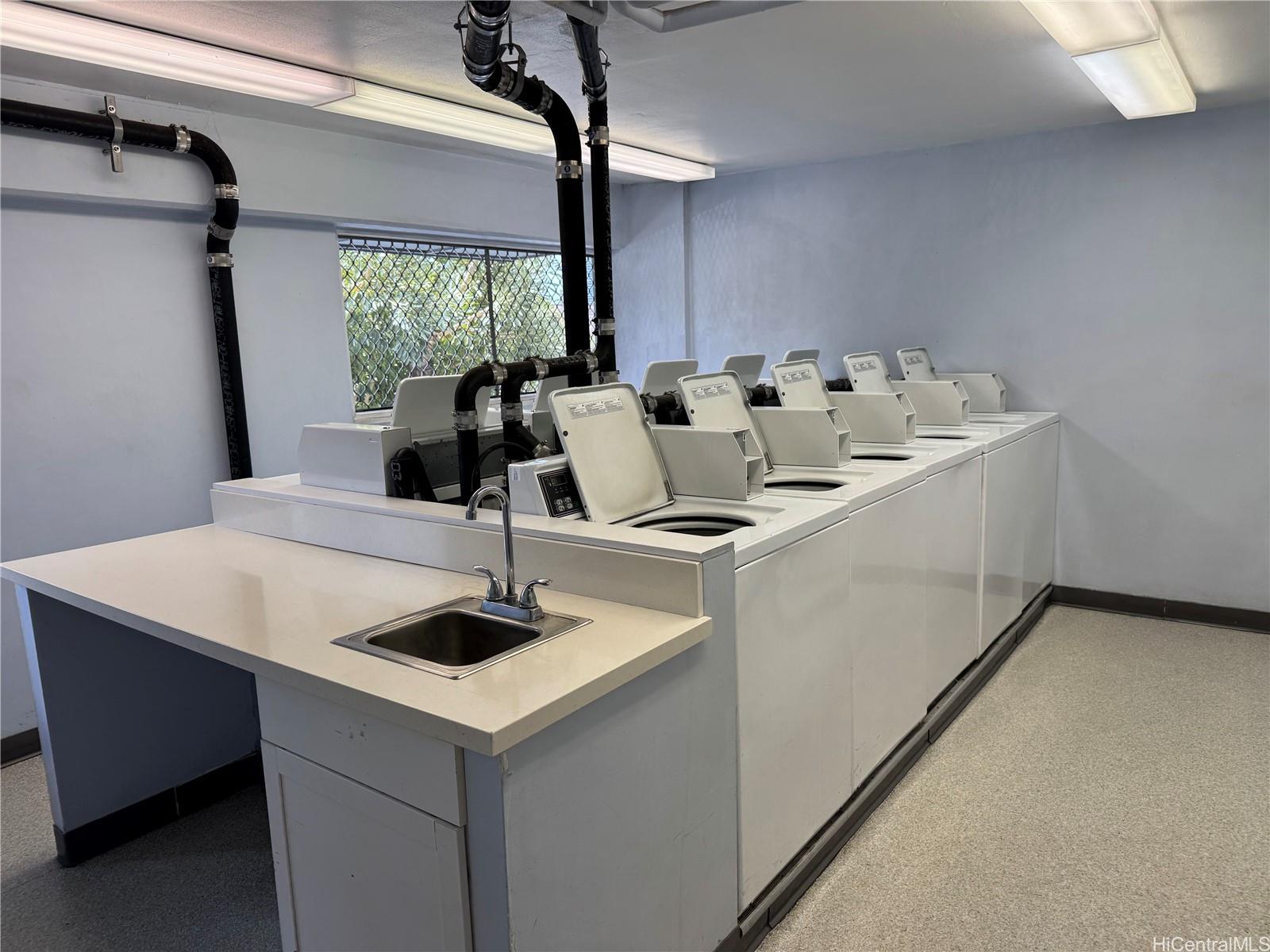824 Kinau Street, Unit 604 Honolulu, HI 96813 - Photo 9 of 9 a view of kitchen island with furniture and wooden floor
