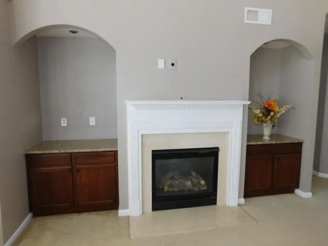 a living room with a fireplace