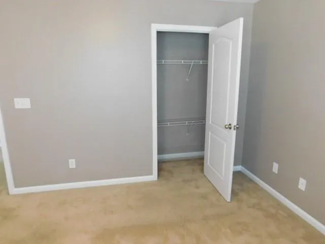 a room with a sink and cabinets