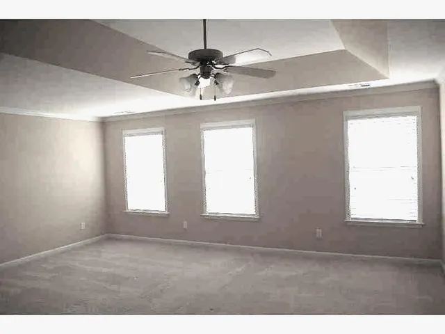 a bathroom with a shower and a sink
