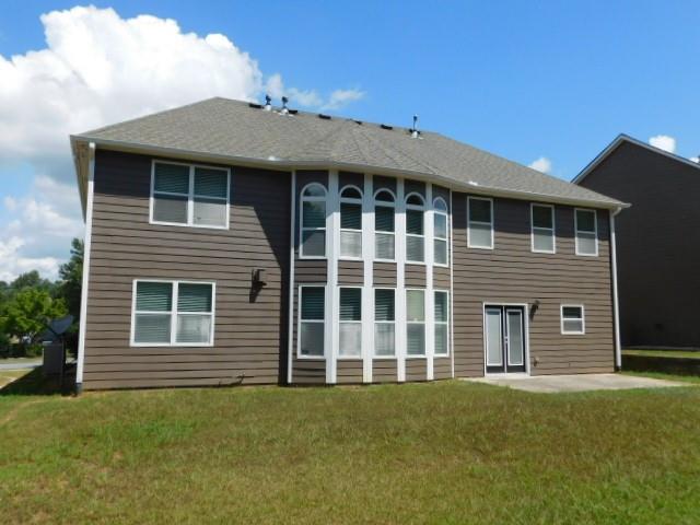 1476 Blue Sail Avenue Grayson, GA 30017 - Photo 36 of 36 a front view of a house with a garden