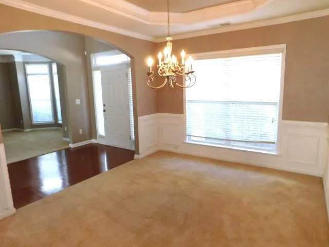 a view of a windows and chandelier in a room