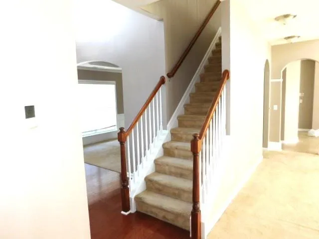 a view of a hallway with staircase