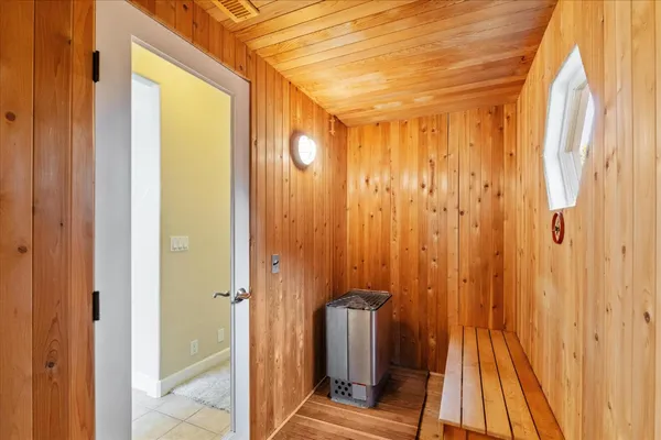 a view of a storage and utility room with washer and dryer
