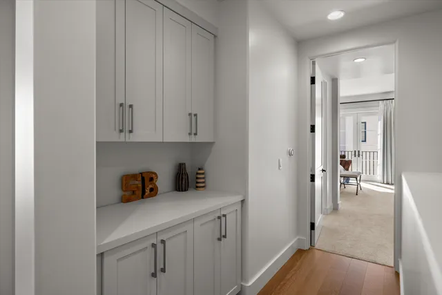a view of cabinets and wooden floor