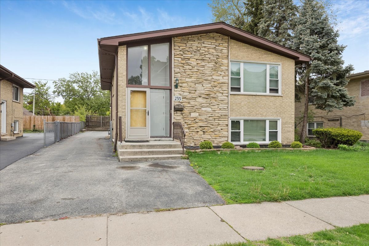 255 East Burlington Street, Unit 1 Riverside, IL 60546 - Photo 1 of 17 a view of a house with backyard and garden