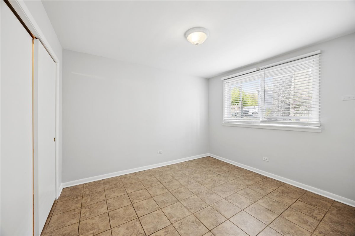 255 East Burlington Street, Unit 1 Riverside, IL 60546 - Photo 8 of 17 an empty room with windows