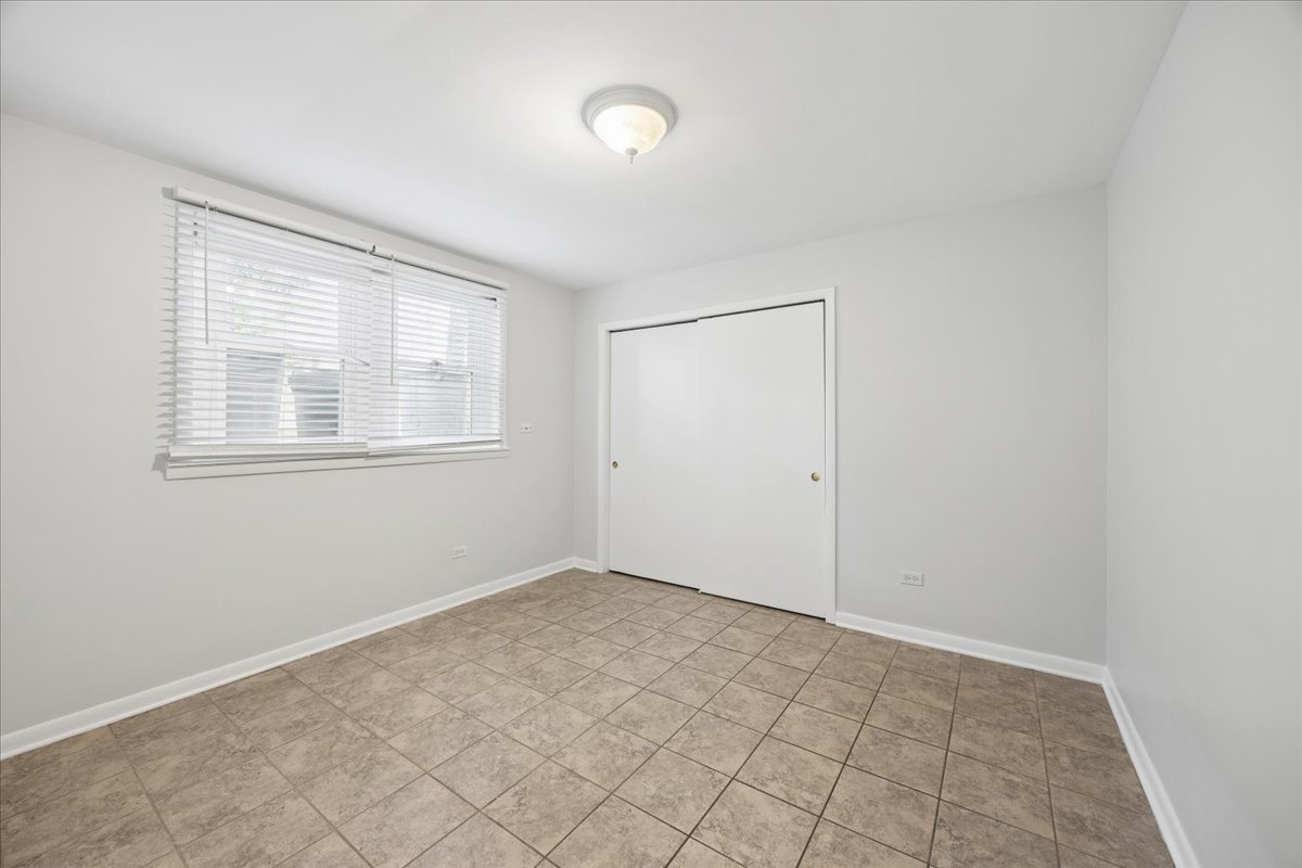 255 East Burlington Street, Unit 1 Riverside, IL 60546 - Photo 10 of 17 an empty room with windows