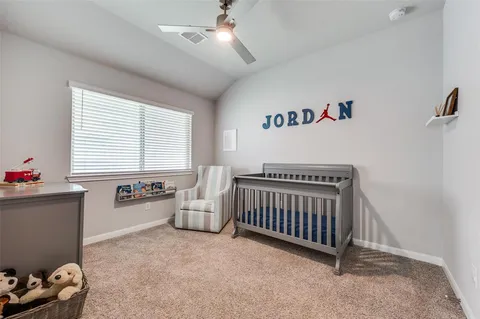 a bedroom with furniture and a window