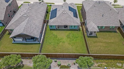 an aerial view of a house with a garden