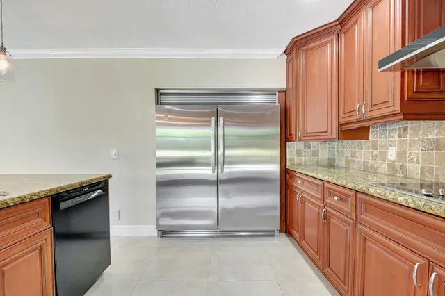 a kitchen with lots of counter space and a window