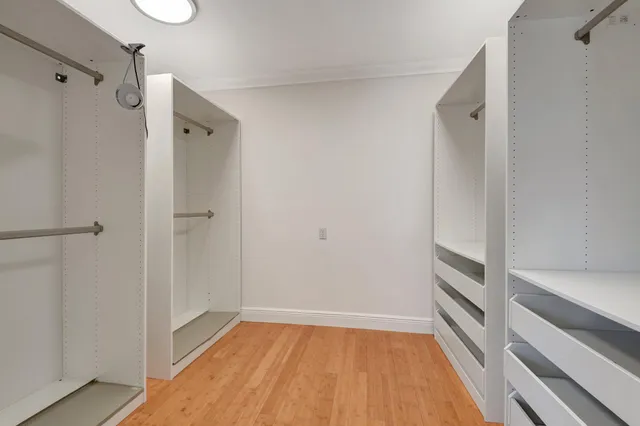 a spacious bathroom with a granite countertop tub shower and sink
