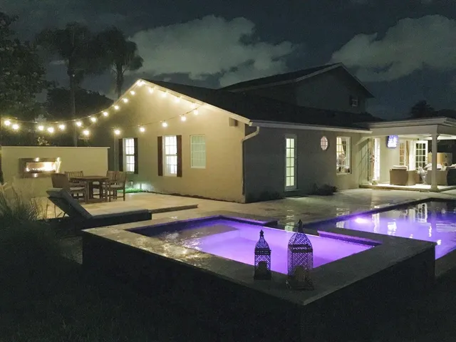 a view of a lobby with table and chairs