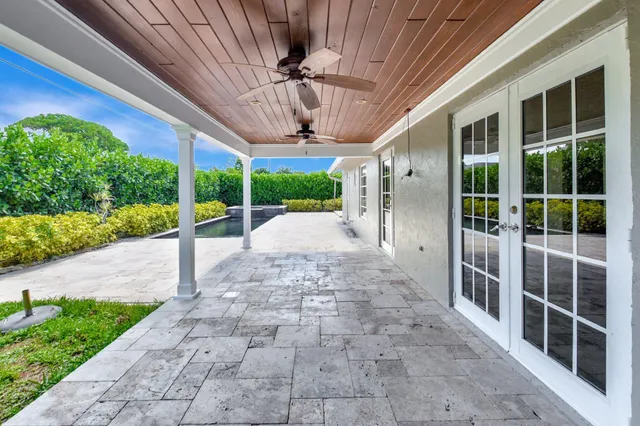 a view of a backyard with porch