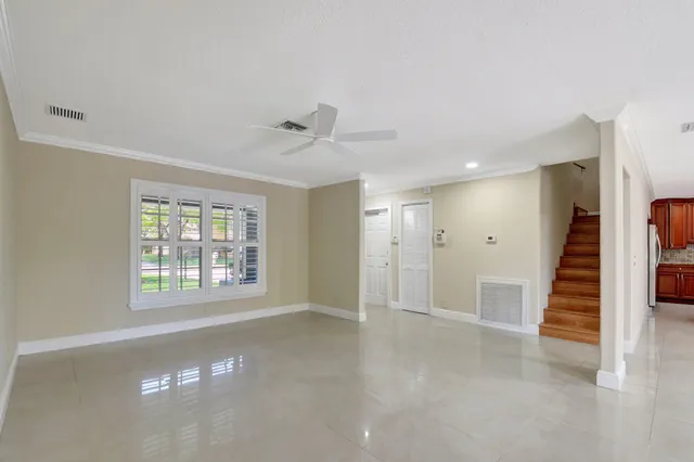 a view of an empty room with a window