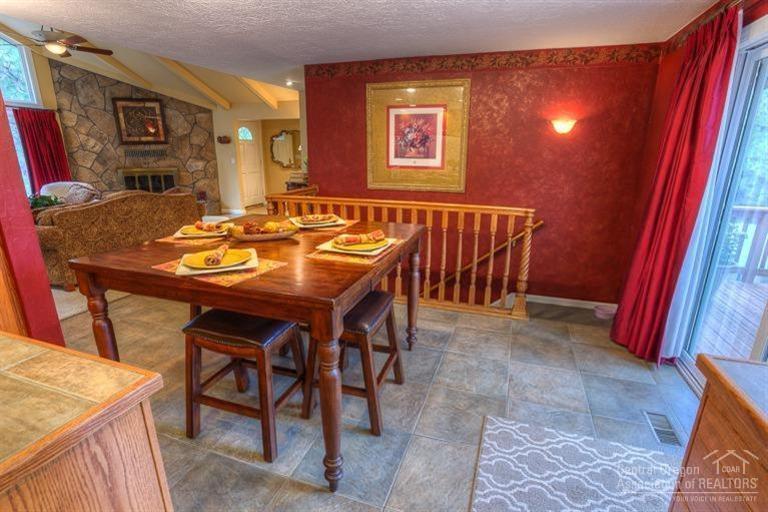 60192 West Ridgeview Drive Bend, OR 97702 - Photo 9 of 25 a view of a dining room with furniture and wooden floor