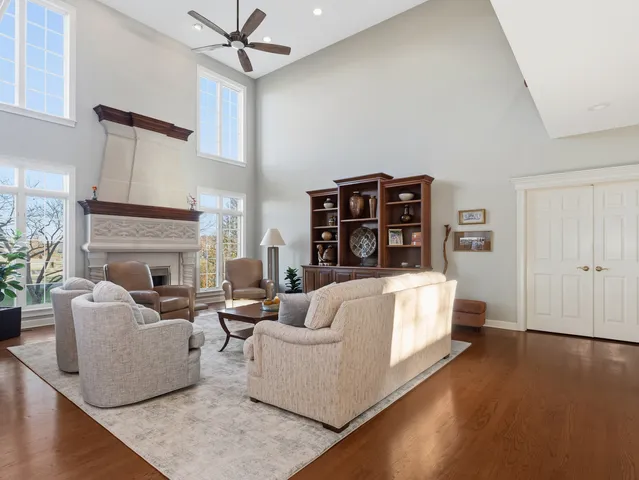 a view of a dining room with furniture wooden floor and chandelier