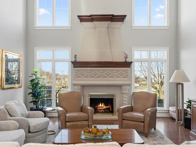 a bedroom with furniture and a fireplace