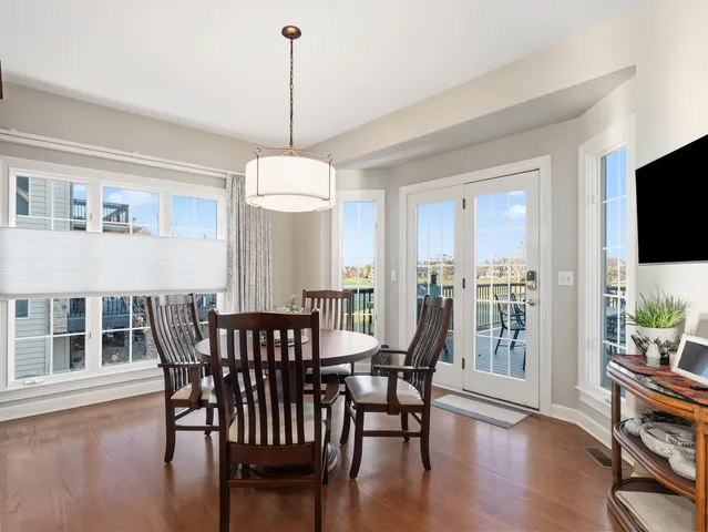 a bathroom with a granite countertop double vanity sink and a mirror