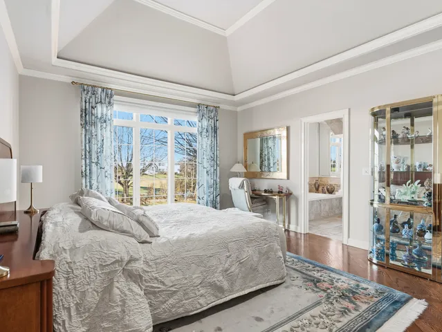 a bath room with a toilet a bath tub and a shower