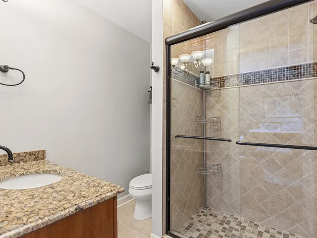 an aerial view of a house with yard swimming pool and outdoor seating