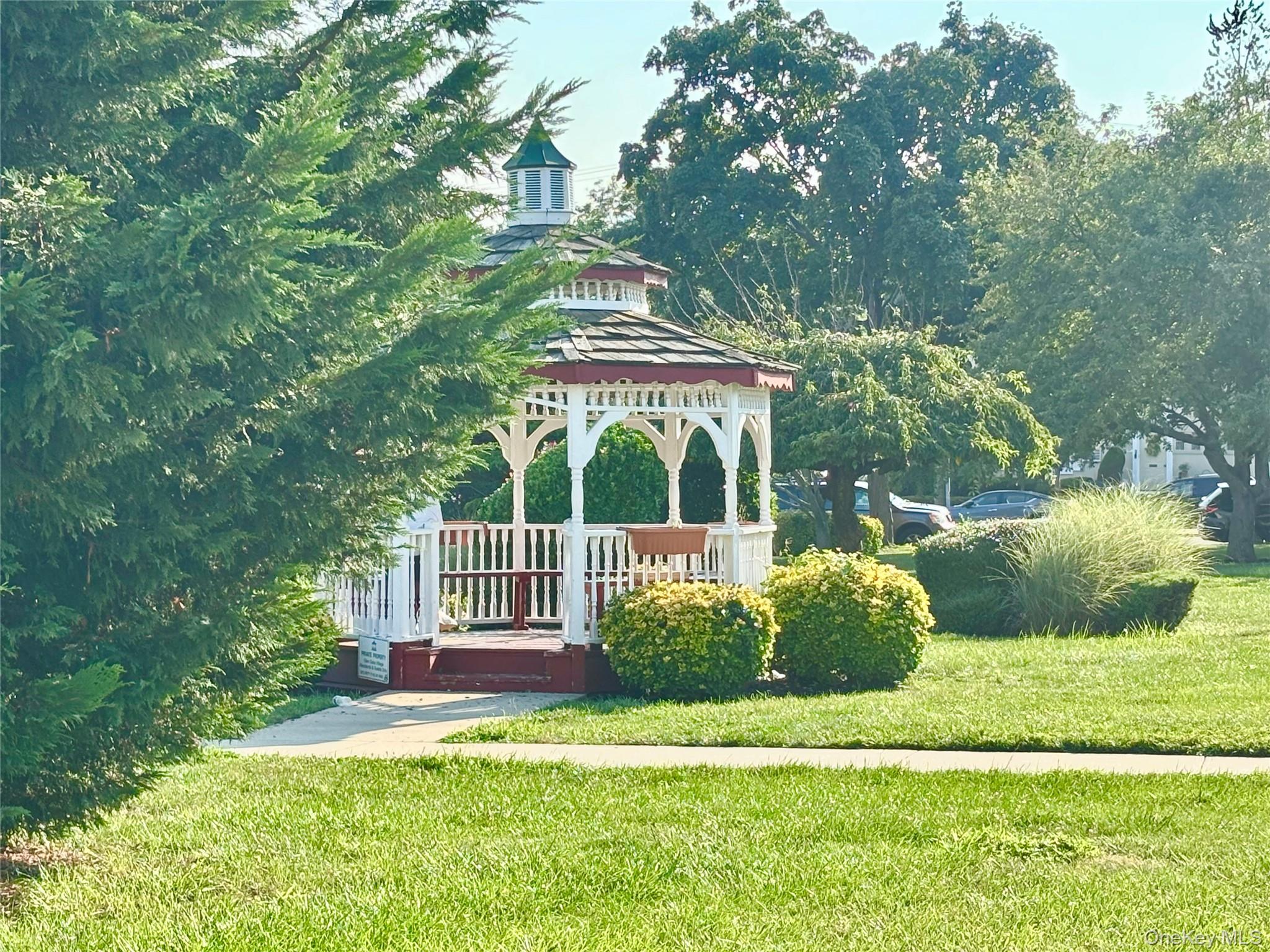 72-29 Little Neck Parkway, Unit 2 Queens, NY 11426 - Photo 23 of 24 a front view of a house with a yard