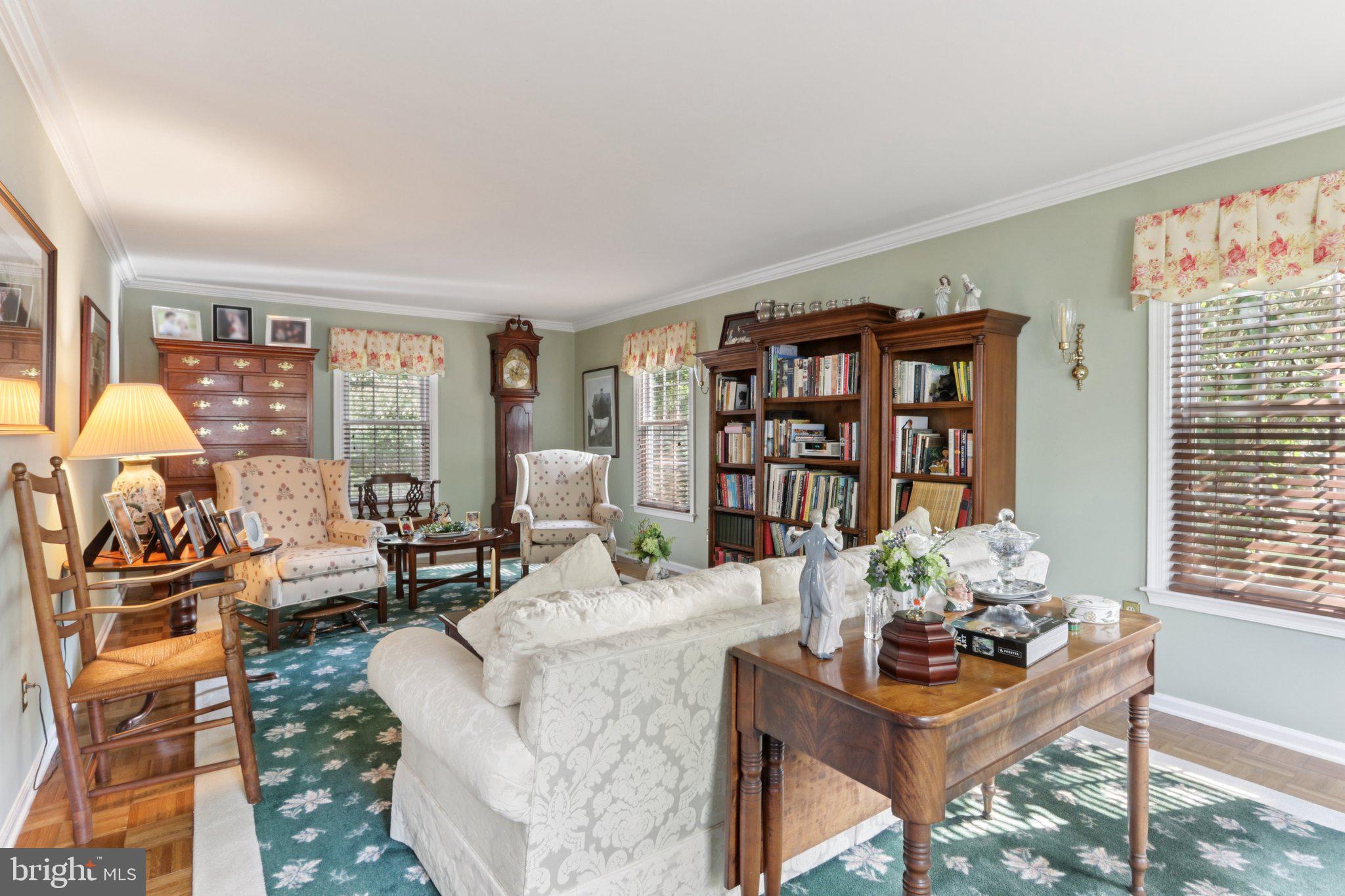 294 Batleson Road Ambler, PA 19002 - Photo 16 of 50 a living room with furniture a bookshelf and a window