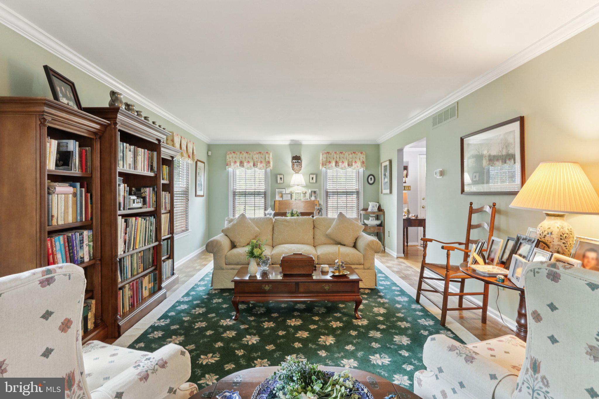 294 Batleson Road Ambler, PA 19002 - Photo 18 of 50 a living room with furniture a rug and a book shelf