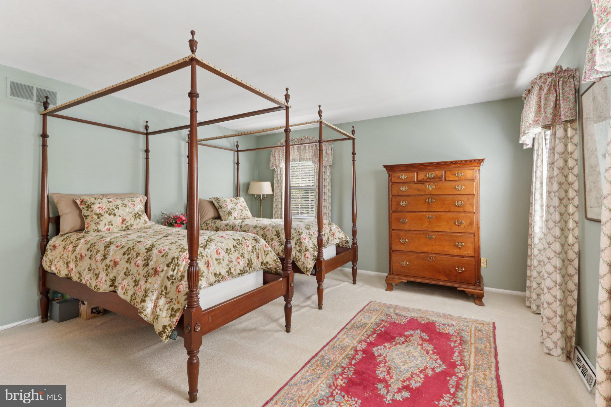 294 Batleson Road Ambler, PA 19002 - Photo 28 of 50 a bedroom with a bed a dresser and a window