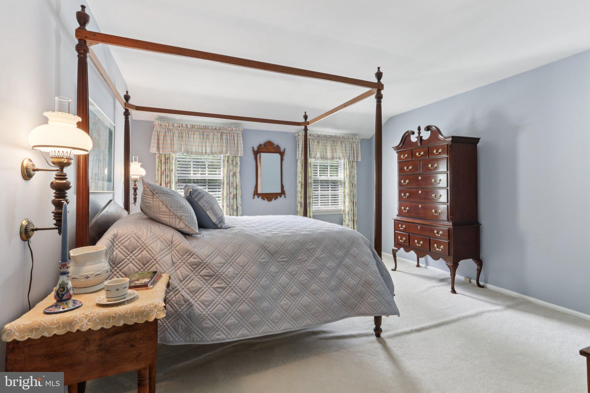 294 Batleson Road Ambler, PA 19002 - Photo 32 of 50 a bedroom with a bed window and walk in closet with wooden floor