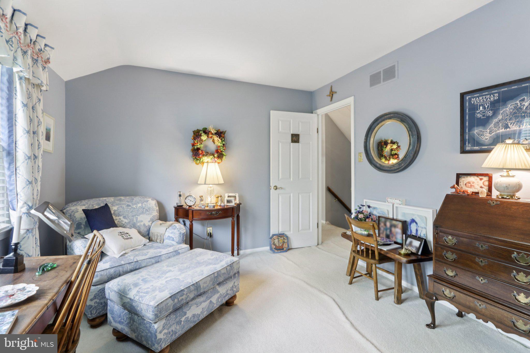 294 Batleson Road Ambler, PA 19002 - Photo 34 of 50 a living room with furniture and a clock on the table