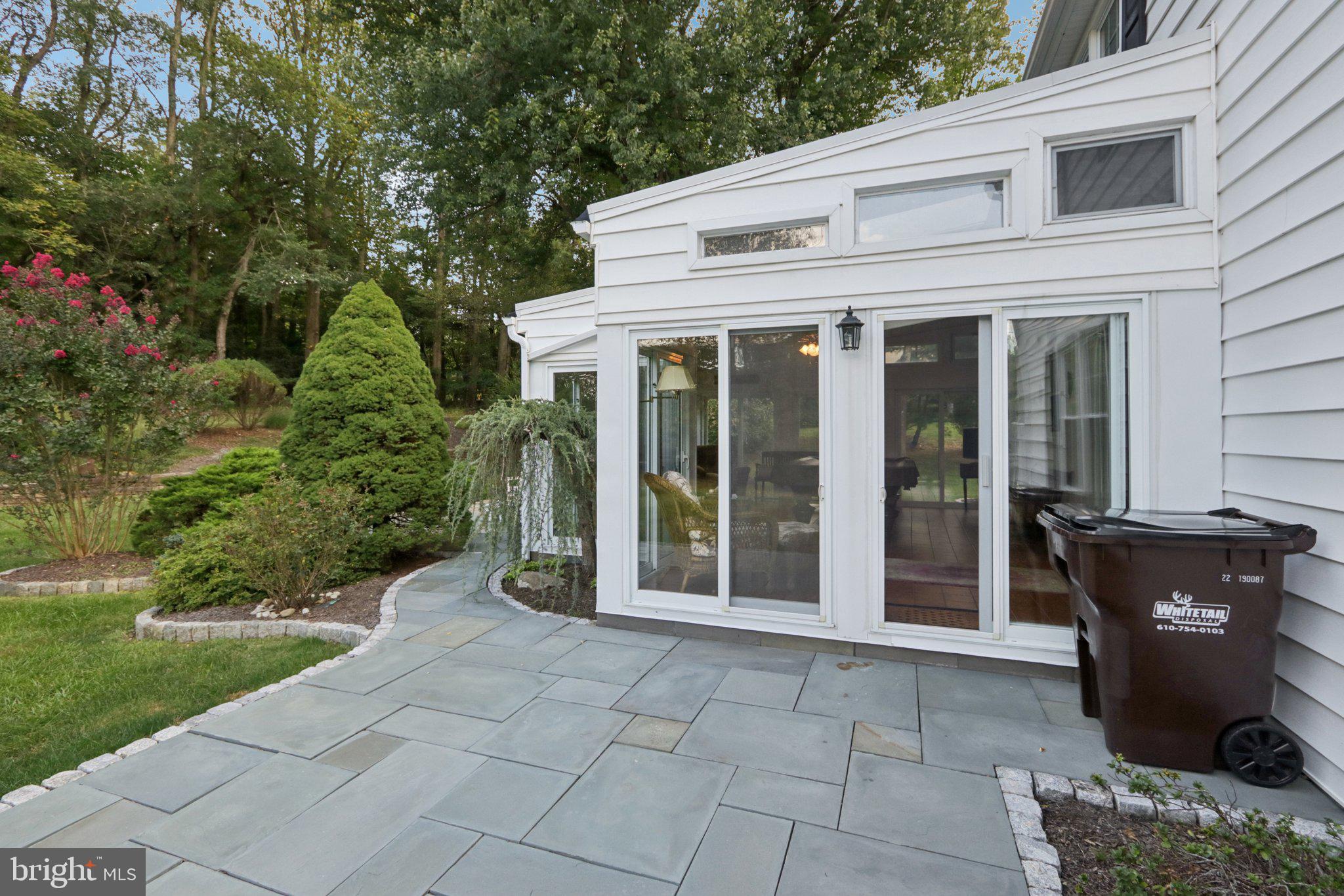 294 Batleson Road Ambler, PA 19002 - Photo 45 of 50 a view of a patio with table and chairs and potted plants