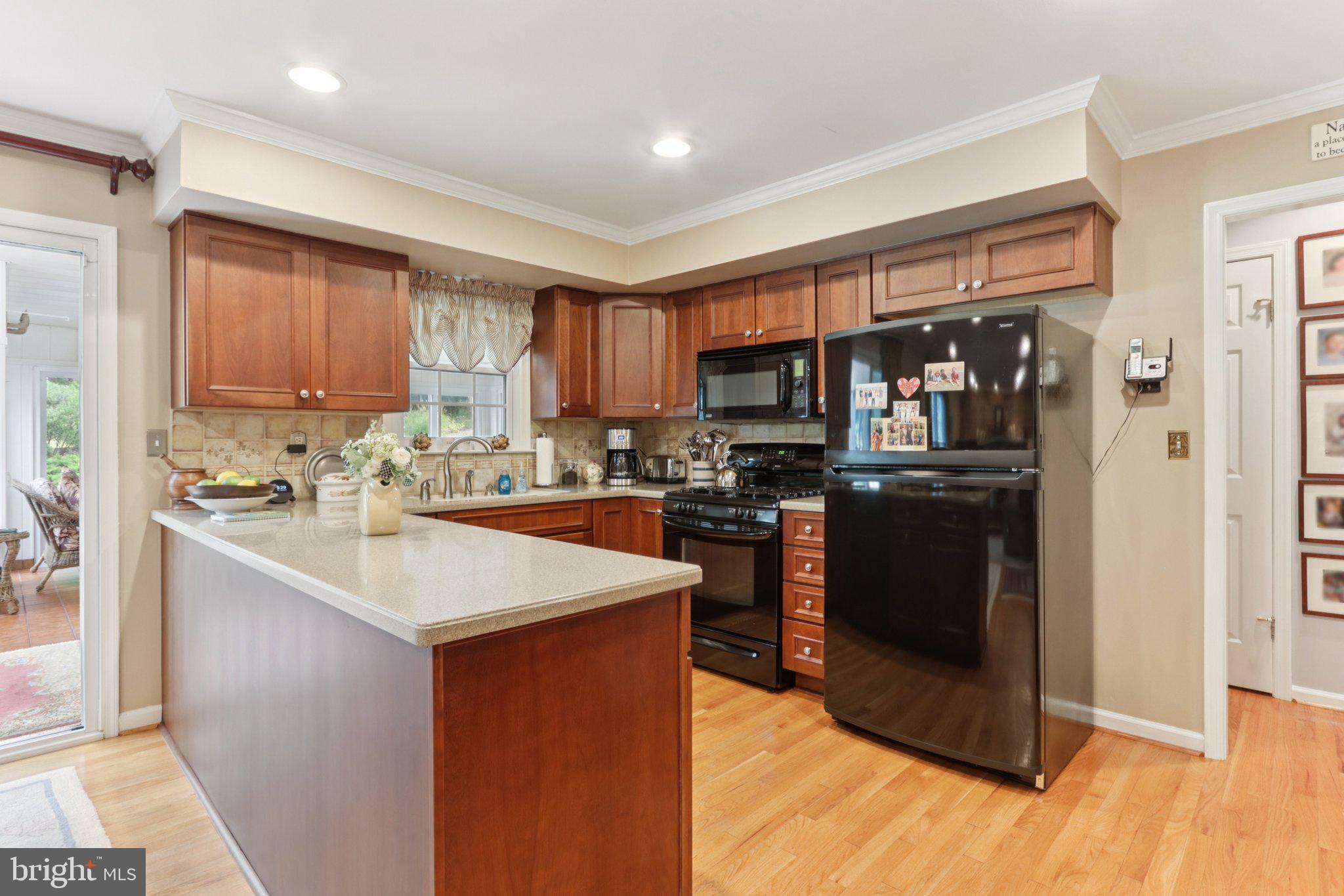 294 Batleson Road Ambler, PA 19002 - Photo 6 of 50 a kitchen with a sink a counter top space and appliances