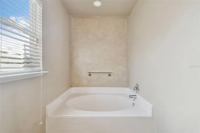 a bathroom with a sink a mirror and a shower