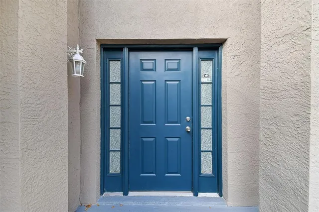 a view of entryway and gallery with wooden floor