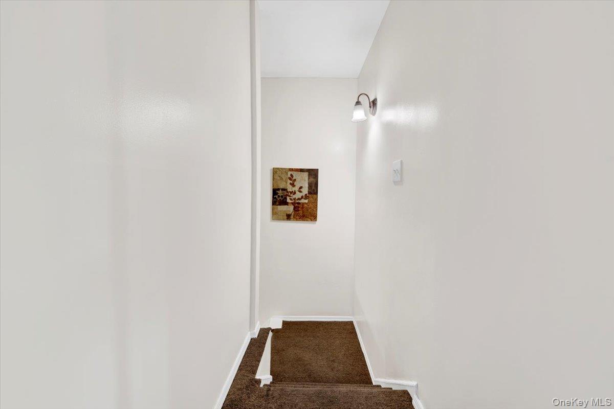 437 Torry Avenue, Unit 2 Bronx, NY 10473 - Photo 14 of 16 Staircase with carpet floors and baseboards