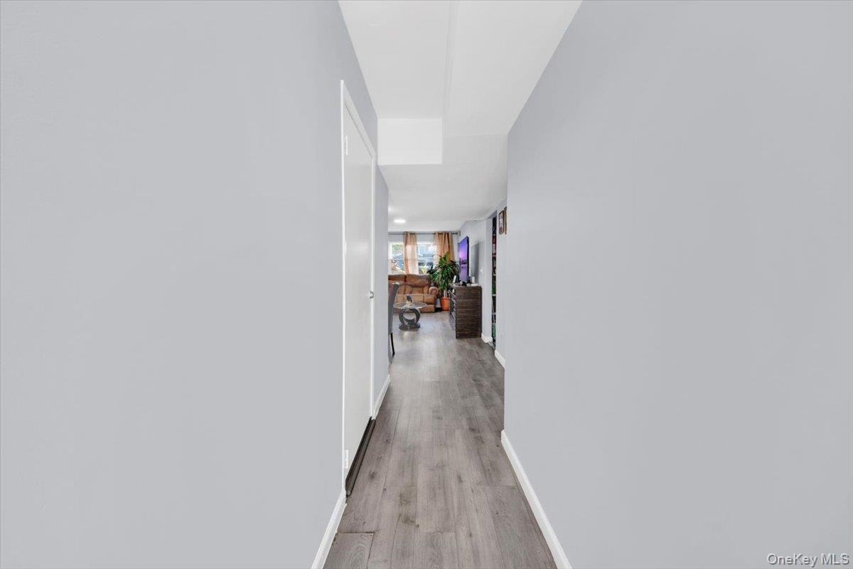 437 Torry Avenue, Unit 2 Bronx, NY 10473 - Photo 3 of 16 Corridor featuring baseboards and light wood-style floors