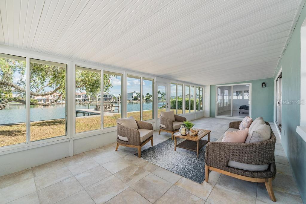 11305 5th Street East Treasure Island, FL 33706 - Photo 22 of 40 a living room with furniture and a large window
