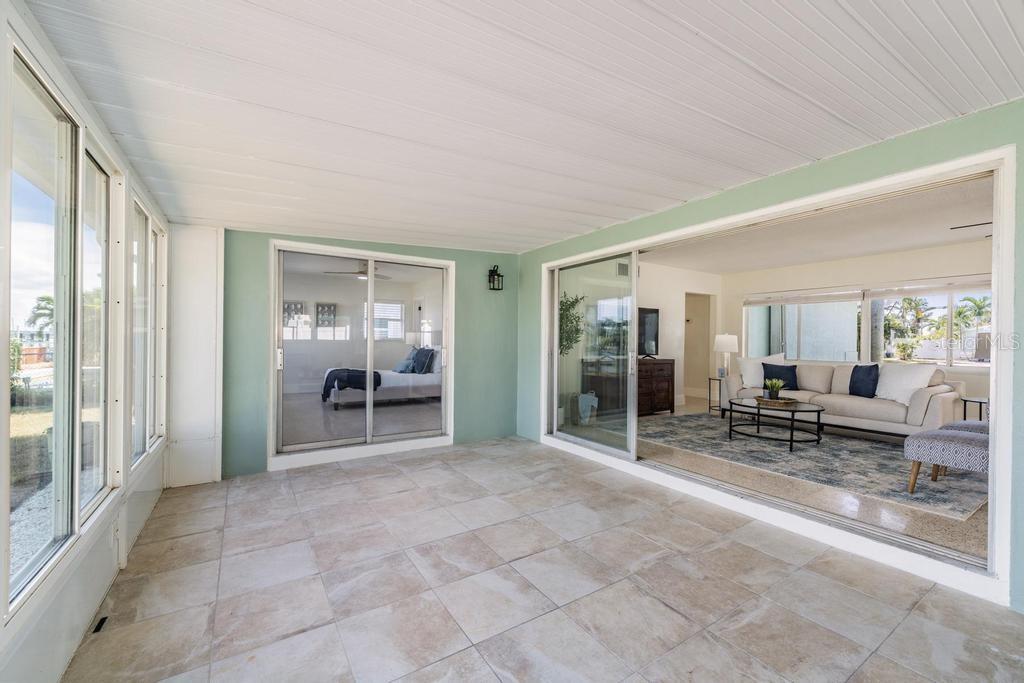 11305 5th Street East Treasure Island, FL 33706 - Photo 24 of 40 a view of a room with furniture and a window