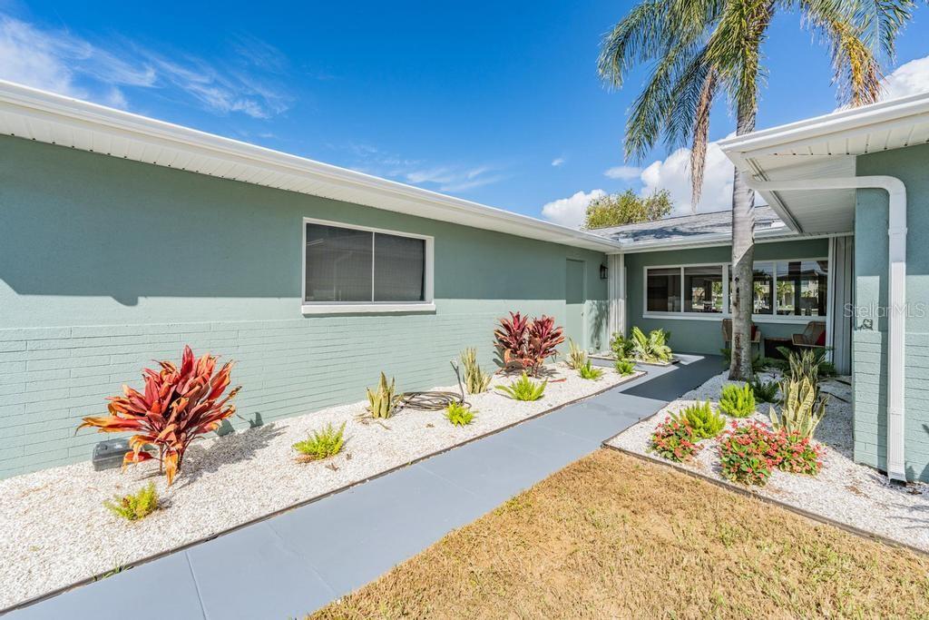 11305 5th Street East Treasure Island, FL 33706 - Photo 38 of 40 a view of a chairs and table in a patio